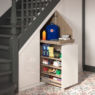 a hidden pull-out storage drawer under the stairs, storing children's shoes