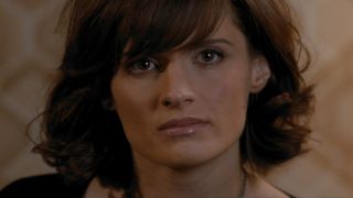 Stana Katic sits during an interrogation in Quantum of Solace.