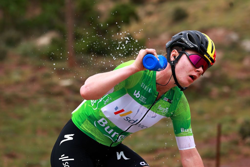 LAGUNAS DE NEILA SPAIN MAY 22 Lotte Kopecky of Belgium and Team SD Worx Green Points Jersey refreshes herself competing in the breakaway during the 7th Vuelta a Burgos Feminas 2022 Stage 4 a 1251km stage from Covarrubias to Lagunas de Neila 1867m VueltaBurgos BurgosFem UCIWWT on May 22 2022 in Lagunas de Neila Spain Photo by Gonzalo Arroyo MorenoGetty Images
