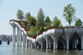 side view of Heatherwick studio's Little Island in New York with its large concrete foundations