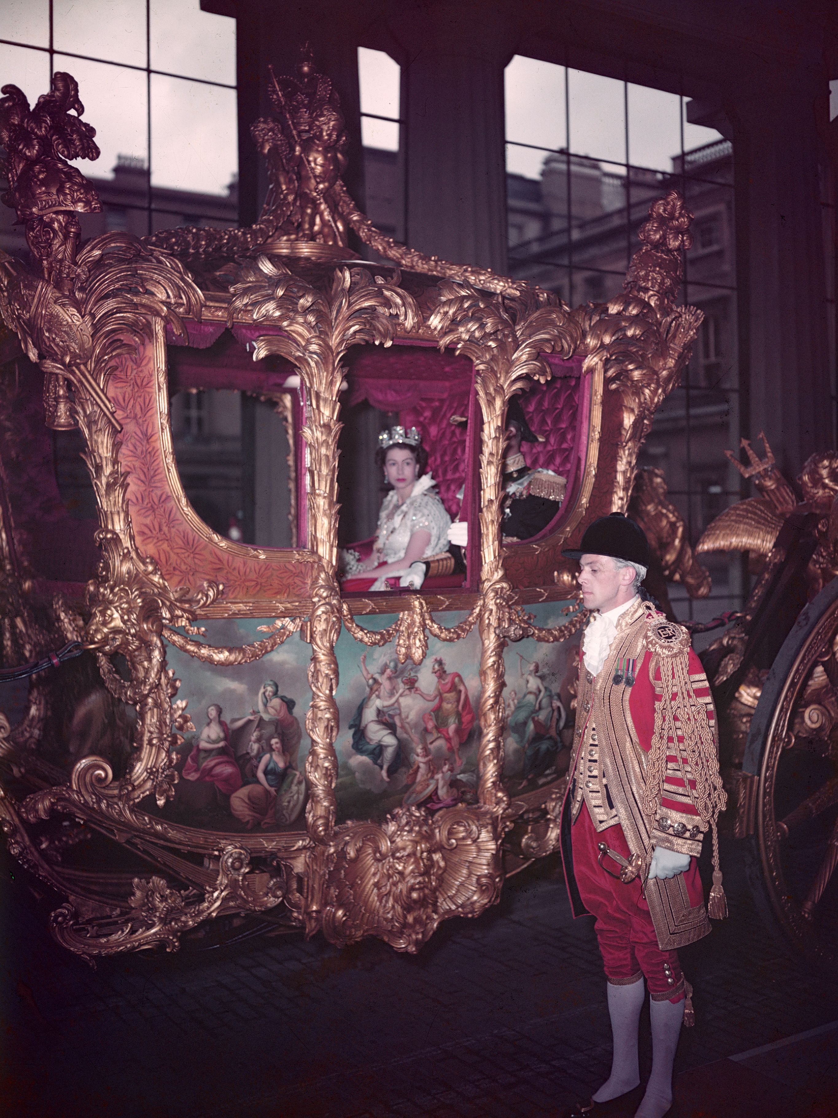 Queen Elizabeth rides in a gold carriage to her coronation on June 2, 1953