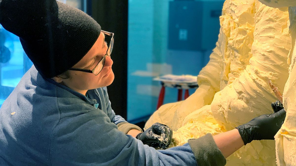 Karen Tharp, a graduate student earning her MFA in ceramics at The Ohio State University, assists with the American Dairy Association's 2,200-lb. butter tribute to the Apollo 11 moon landing.