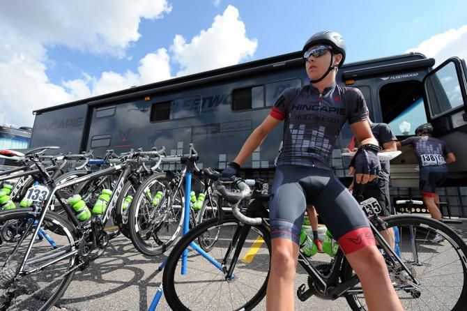 Waiting in front of the team bus to head to the start line.