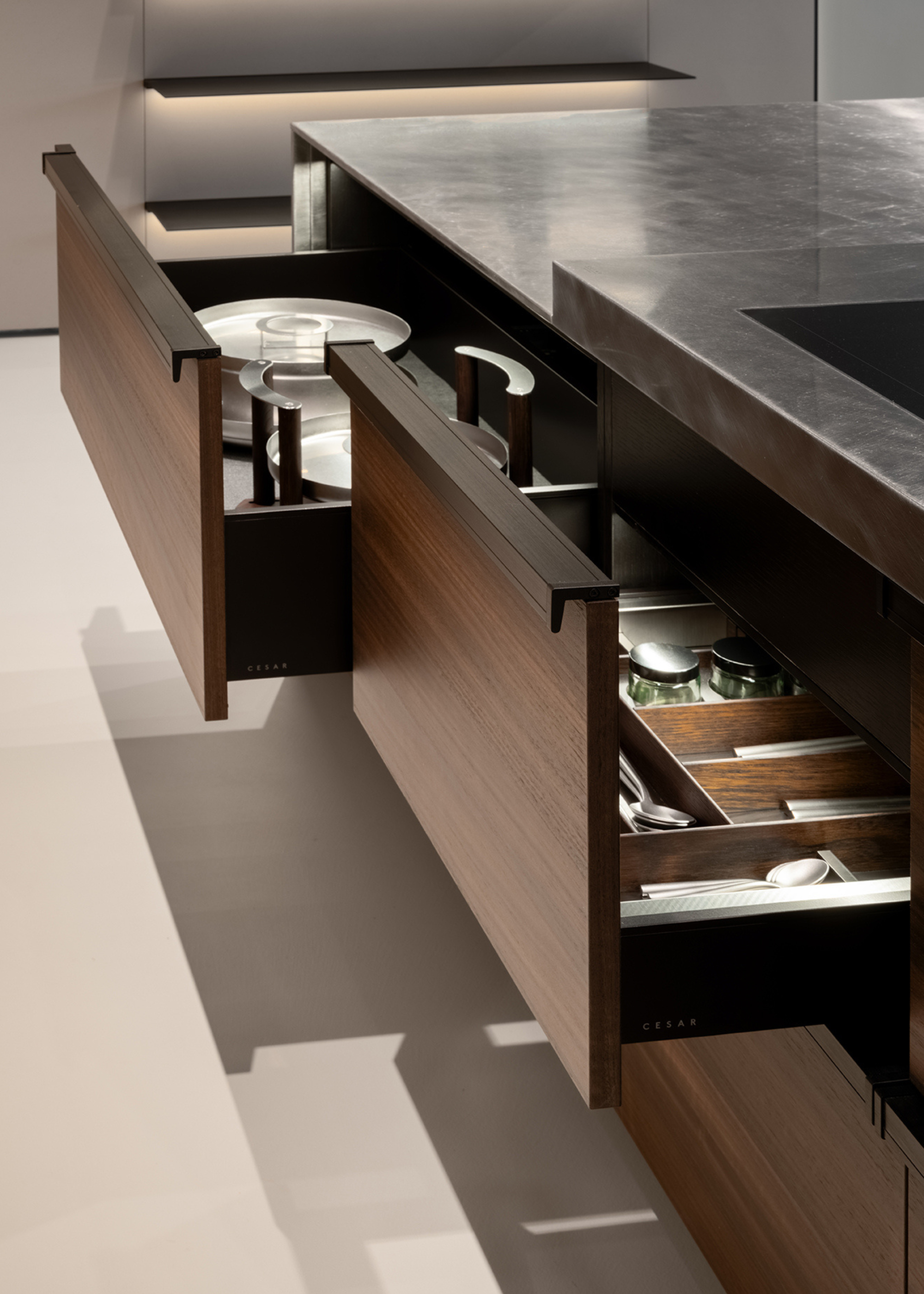 A kitchen island with pull-out drawers
