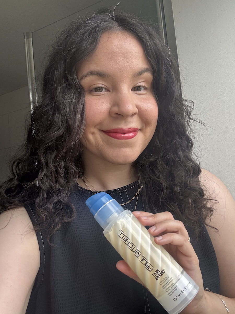 Mica Ricketts holding Paul Mitchell Curls Twirl Around Crunch-Free Curl Definer