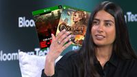 Asha Sharma holding Gears and Clockwork Revolution discs (badly edited in Photoshop)