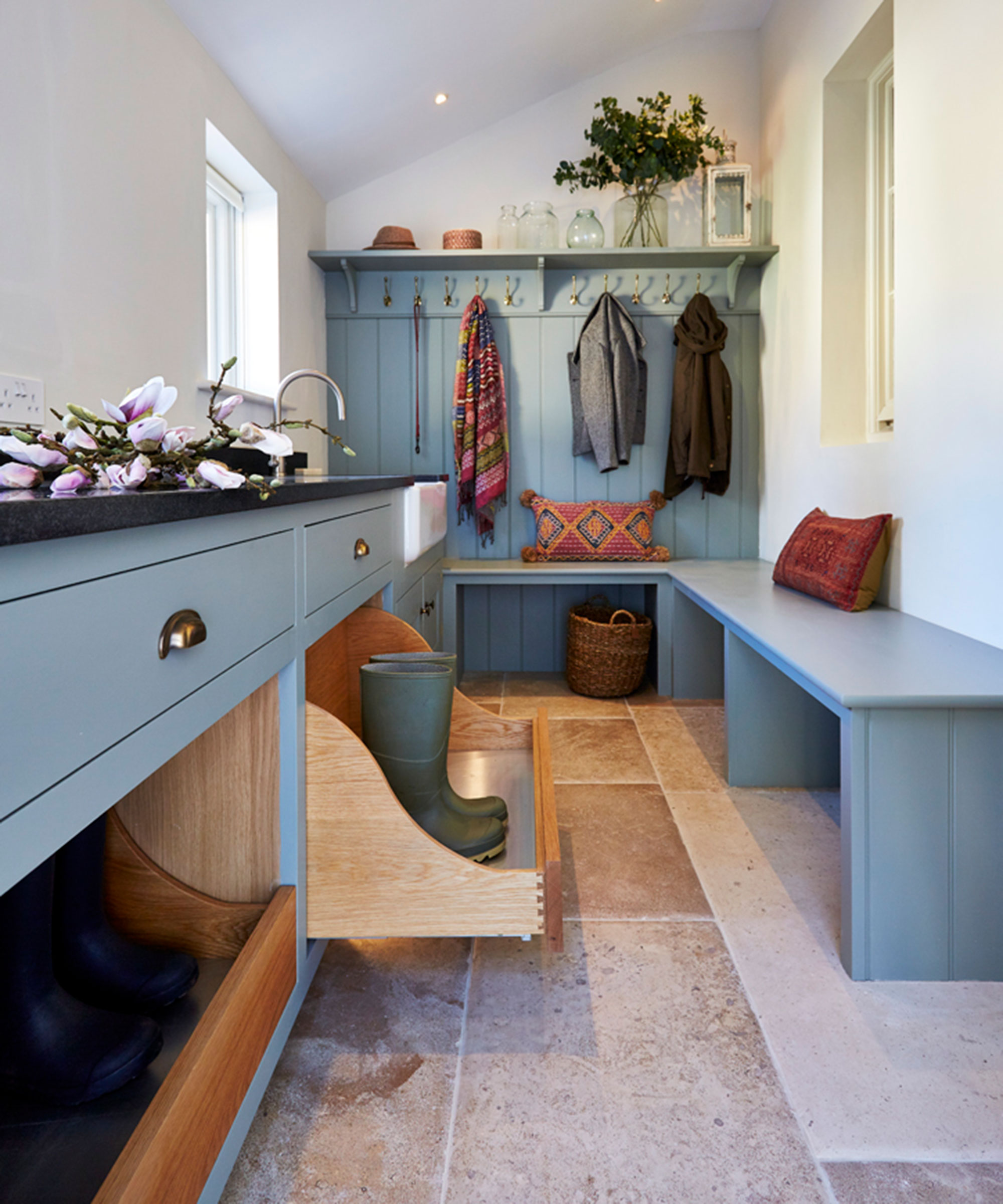 pale blue boot room with stone floor