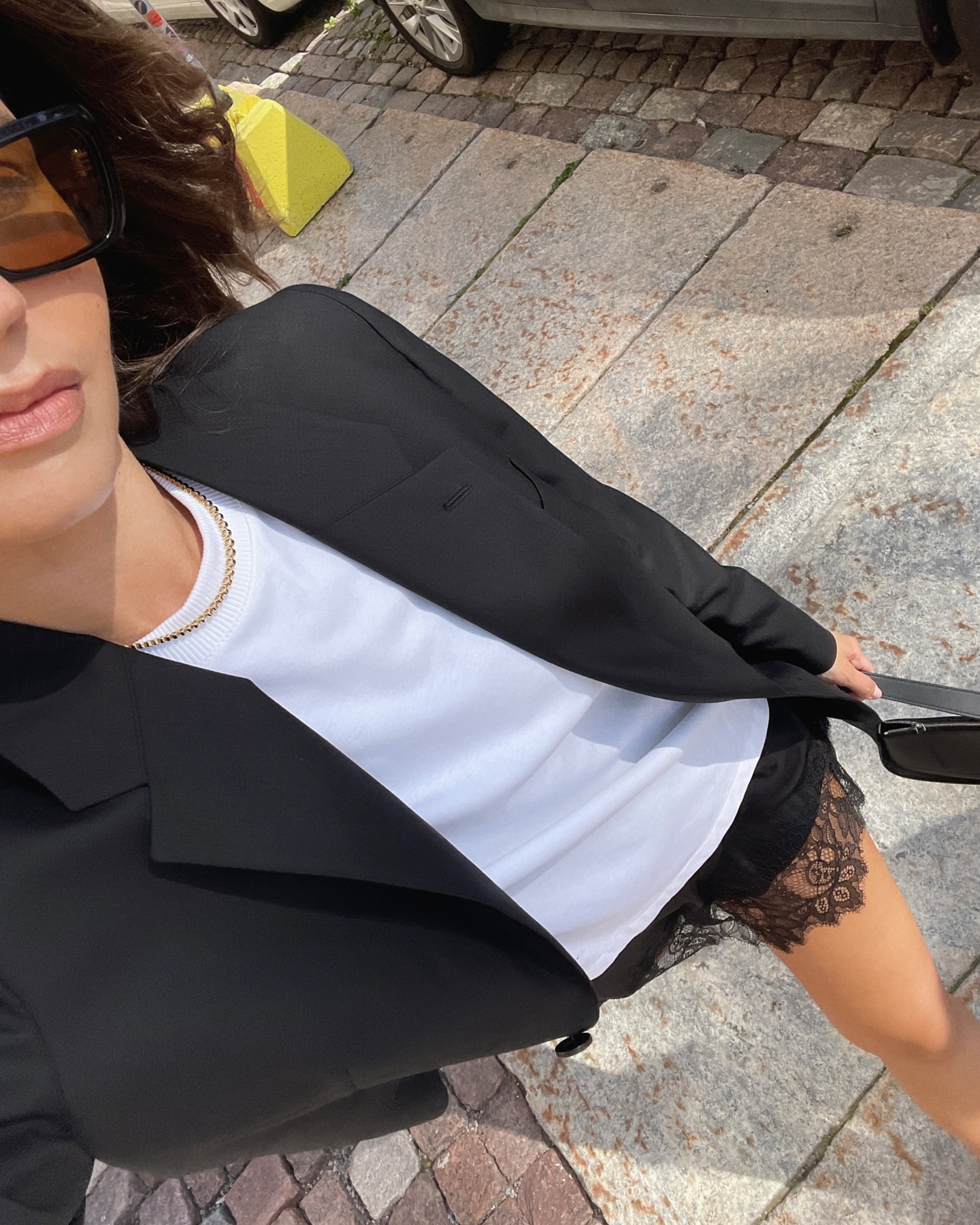 Influencer wears a lace trimmed skirt.