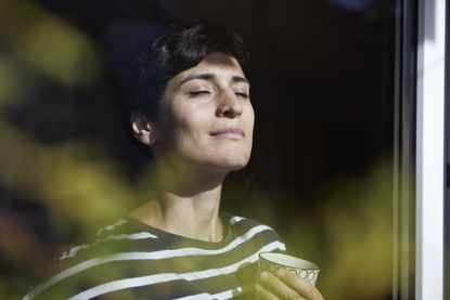 Woman practising breathing exercises for anxiety