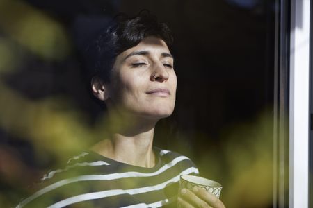 Woman practising breathing exercises for anxiety