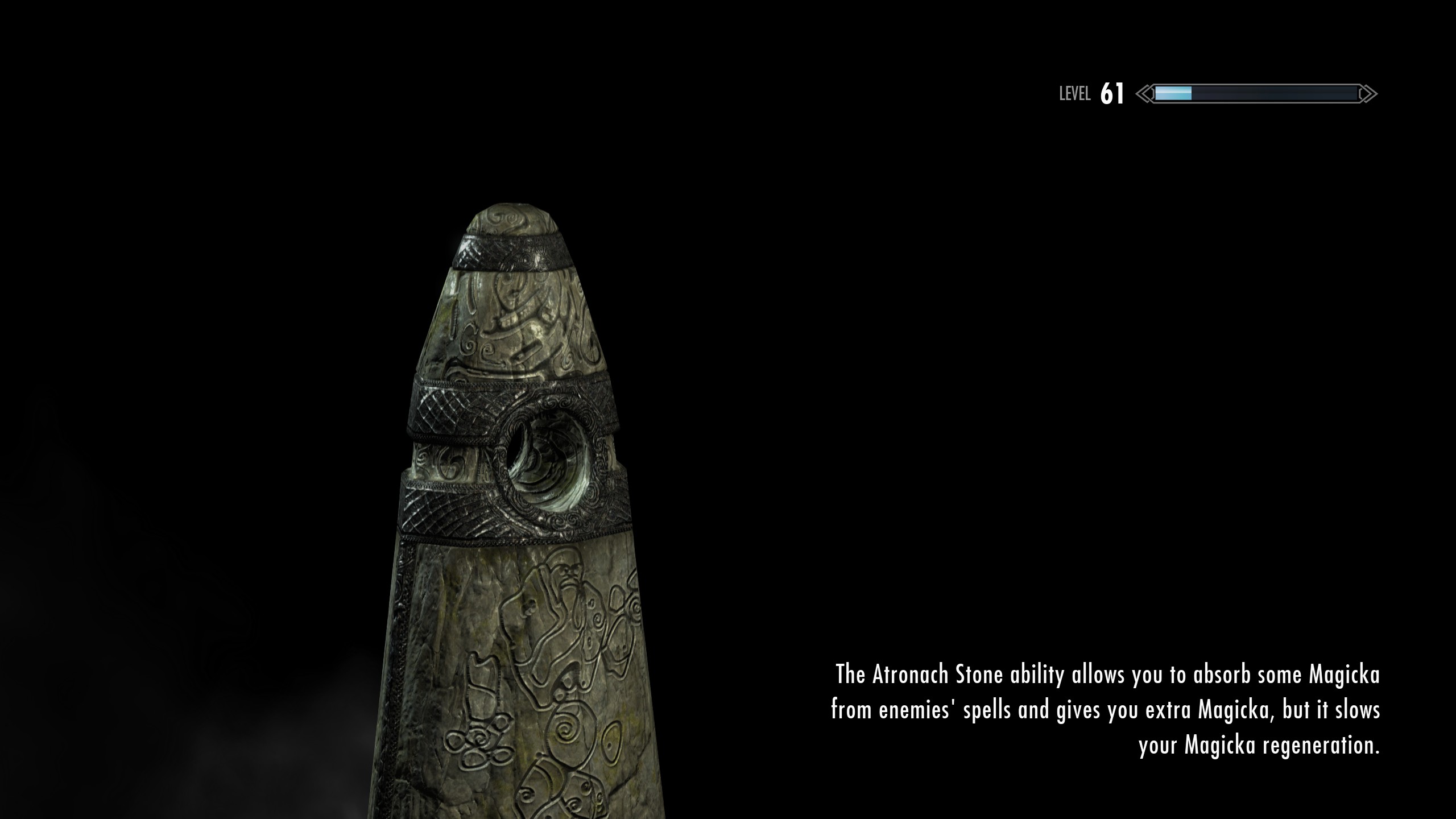 A Skyrim loading screen, showing a stone monolith.