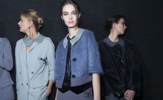 Female models wearing blue and grey clothes from the Giorgio Armani A/W 2015 collection