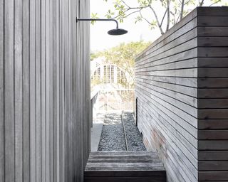 grey outdoor shower with panels