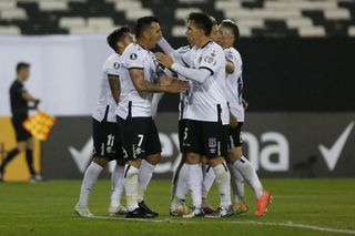 Esteban Paredes #7 of Colo-Colo celebrates with teammates after scoring the second goal of his team on a penalty kick during a group C match between Colo Colo and Peñarol as part of Copa CONMEBOL Libertadores 2020 at Estadio Monumental on September 15, 2020 in Santiago, Chile.