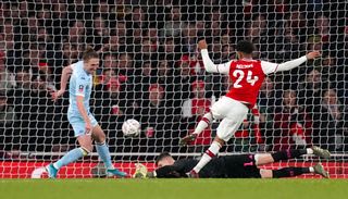 Arsenal’s Reiss Nelson scores his side’s first goal of the game during the FA Cup third round match at Emirates Stadium