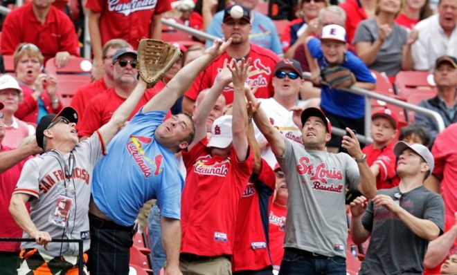 Baby-wearing, beverage-holding man catches foul ball with bare