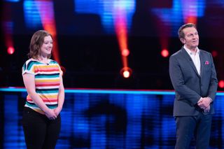 Contestant Caitlin McCulloch in the Beat The Chasers studio with host Bradley Walsh
