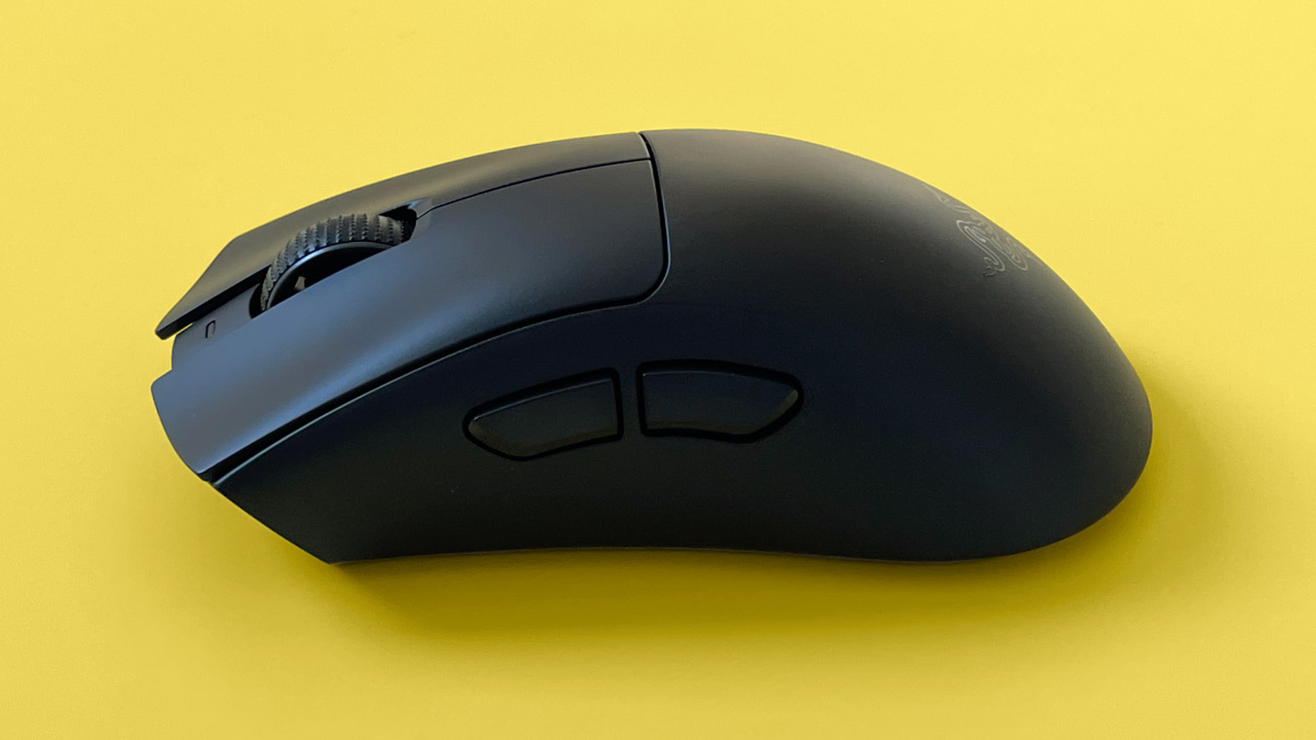 A Razer DeathAdder V3 HyperSpeed mouse against a yellow background.