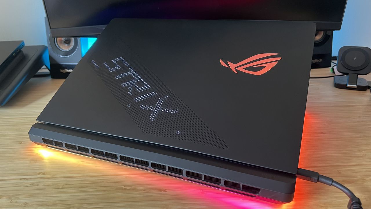 Shot of open lid of Asus ROG Strix Scar 18, showing RGB logo and AniMe Matrix display