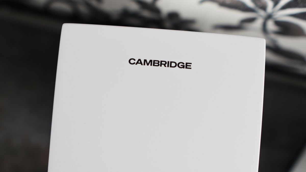 Cambridge Audio's L/R S speakers on a desk. The speakers are white with black tweeters.