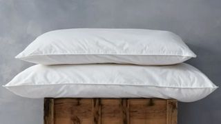 Soak&Sleep pillows stacked on wooden box