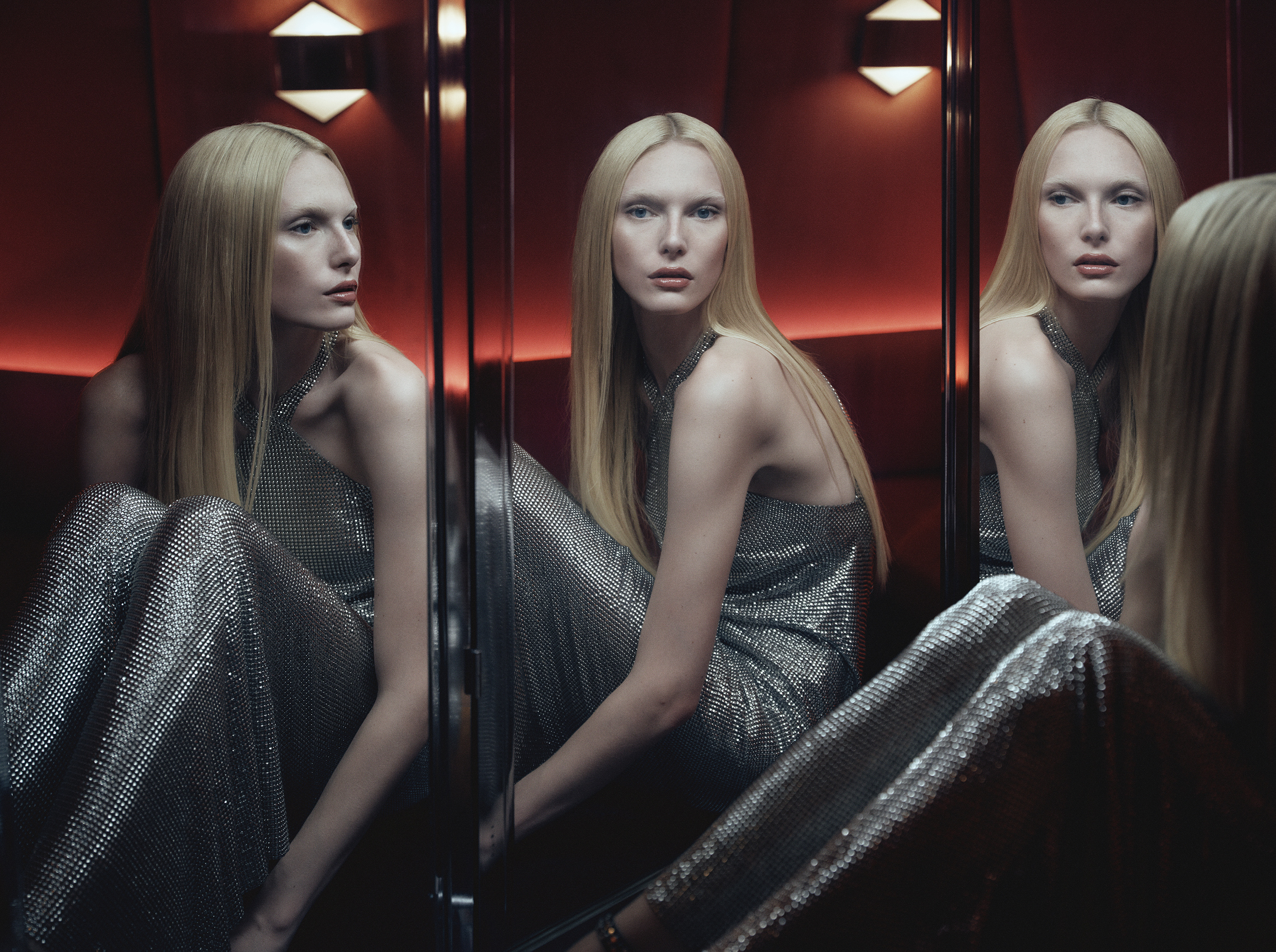 alex consani in Ludovic de Saint Sernin x Zara wearing silver dress and looking into mirror 