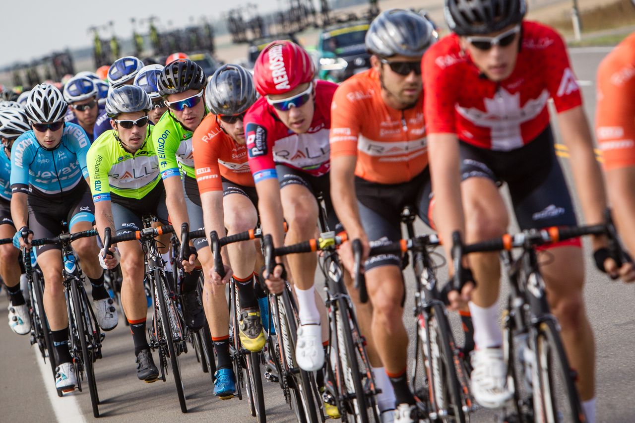 Rally Cycling riders line up in support of race leader Evan Huffman