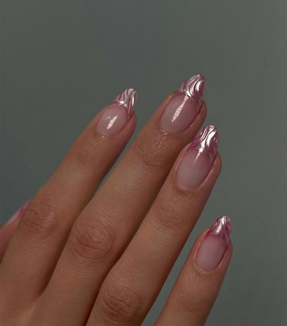 A textured pink chrome French manicure by Queenie Nguyen.