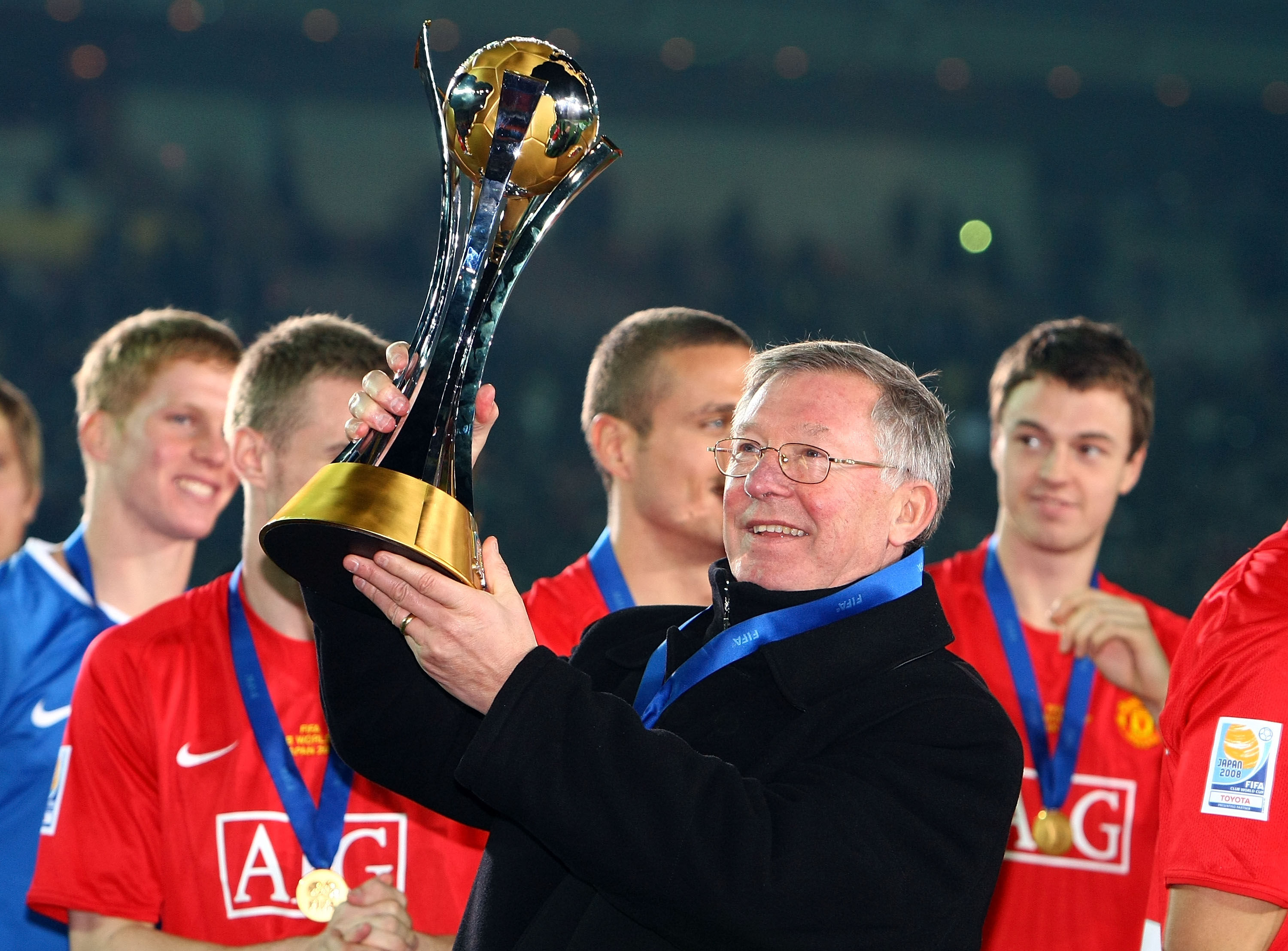 Alex Ferguson celebrates with the FIFA Club World Cup trophy after Manchester United's win over LDU Quito in the final in December 2008.