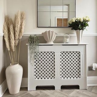 Radiator cover in chic neutral interior set-up