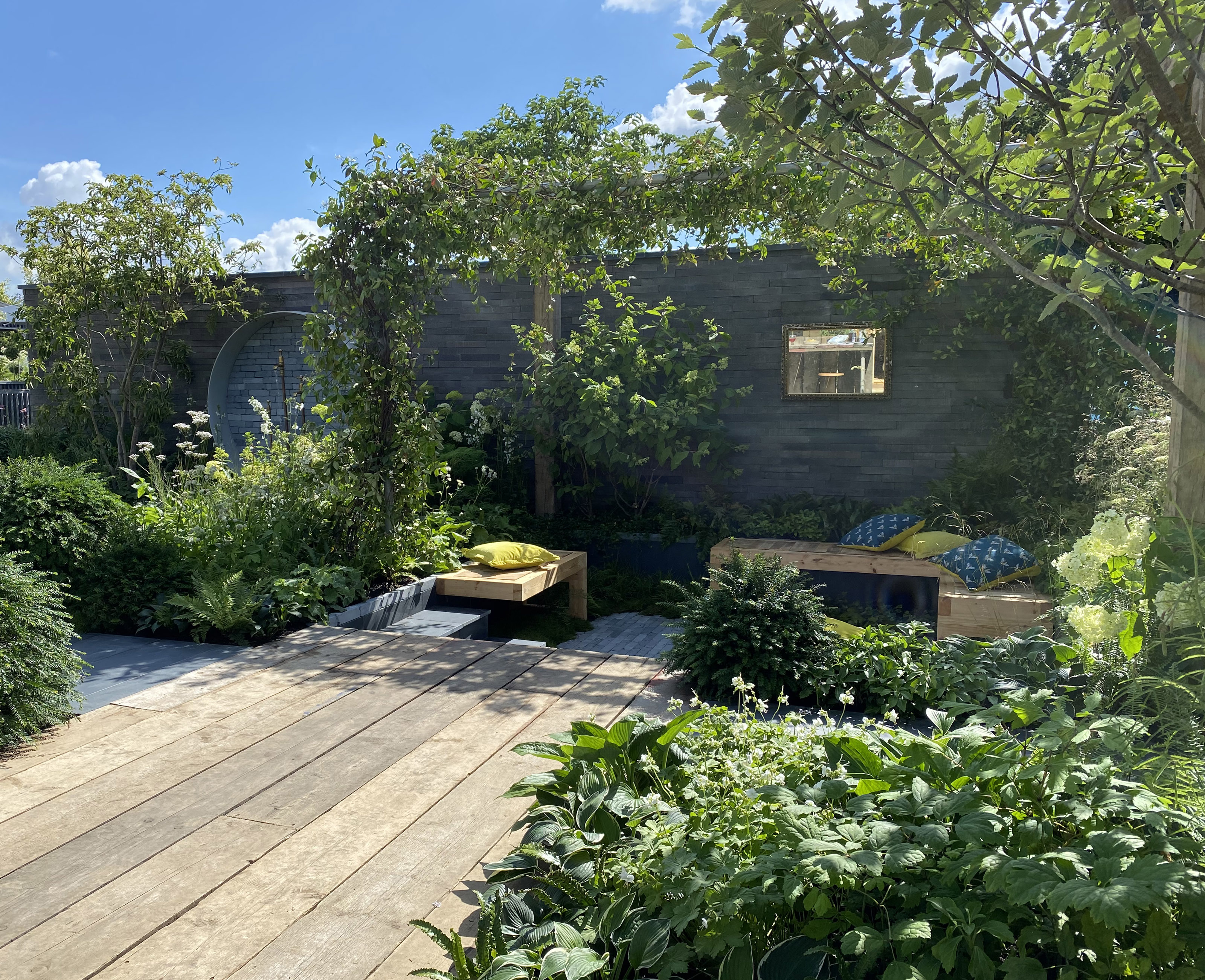 sunken seating area under a pergola in the