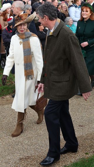 Princess Anne and Vice Admiral Timothy Laurence walk to the Royal Family's traditional Christmas Day service at St Mary Magdalene Church in Sandringham