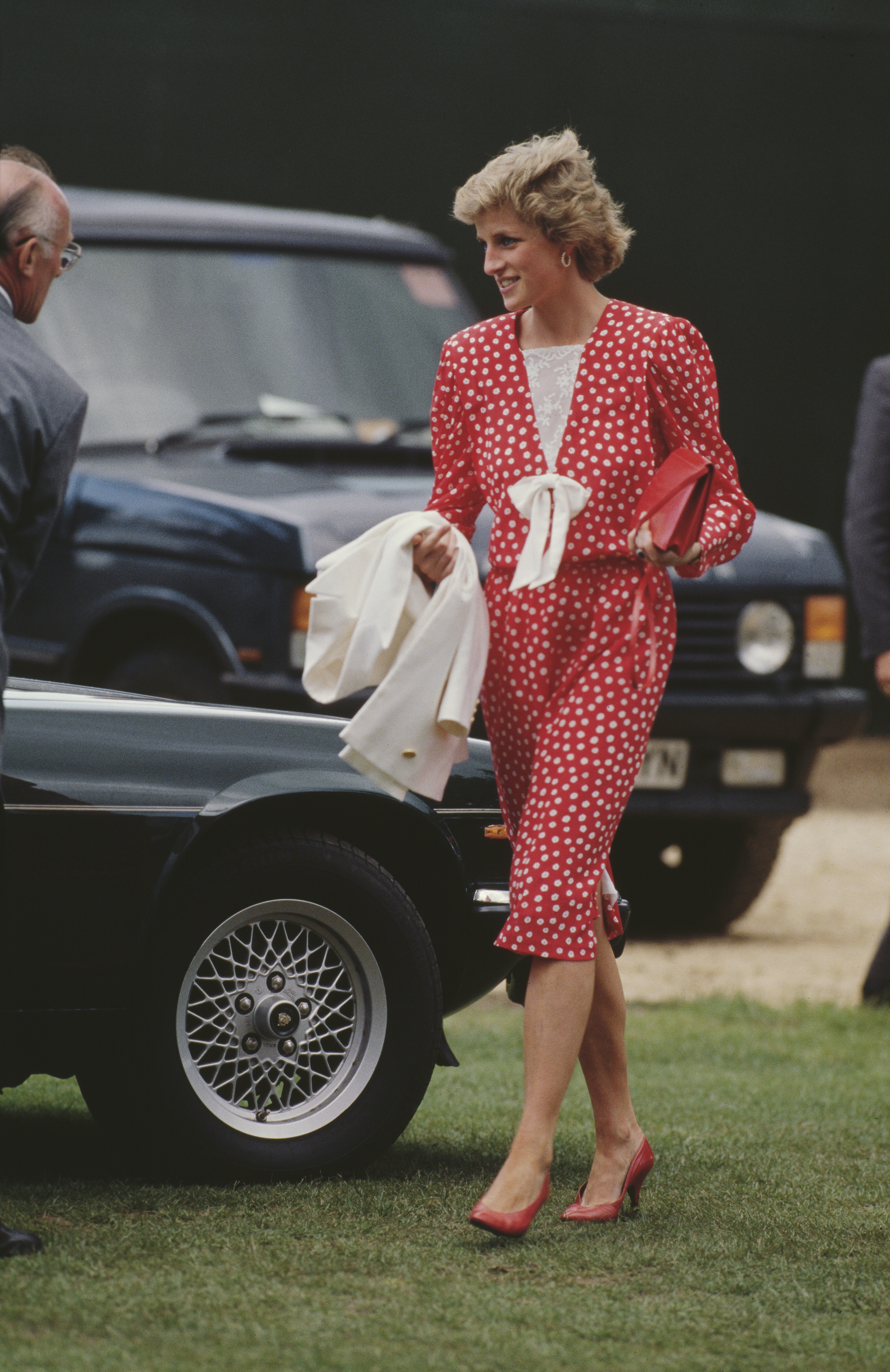 Princess Diana wearing a red polka dot dress