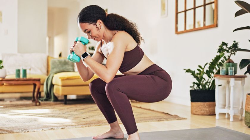 a photo of a woman doing a squat