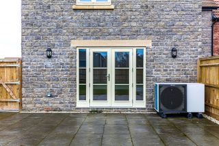 daikin monobloc air source heat pump outside house