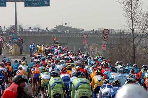The riders about to start as the red flag waves in the neutral zone
