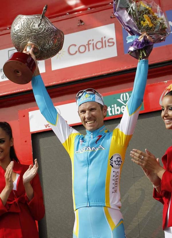 Fredrik Kessiakoff (Astana) salutes from the podium.