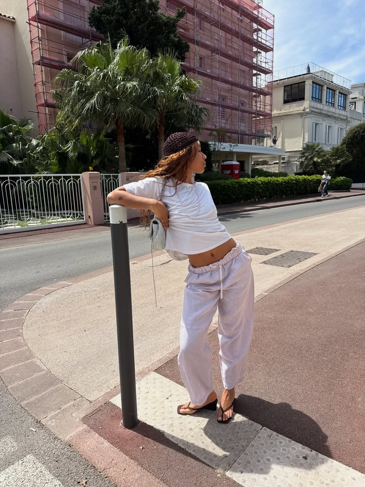 @fiahamelijnck wearing drawstring trousers and wedge sandals.