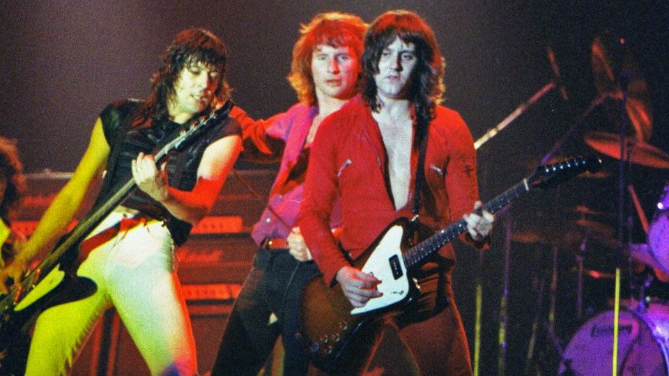 Neil Carter, Phil Mogg and Paul Chapman of UFO perform on stage at The Reading Festival on August 23rd, 1980 in Reading, Berkshire, England.