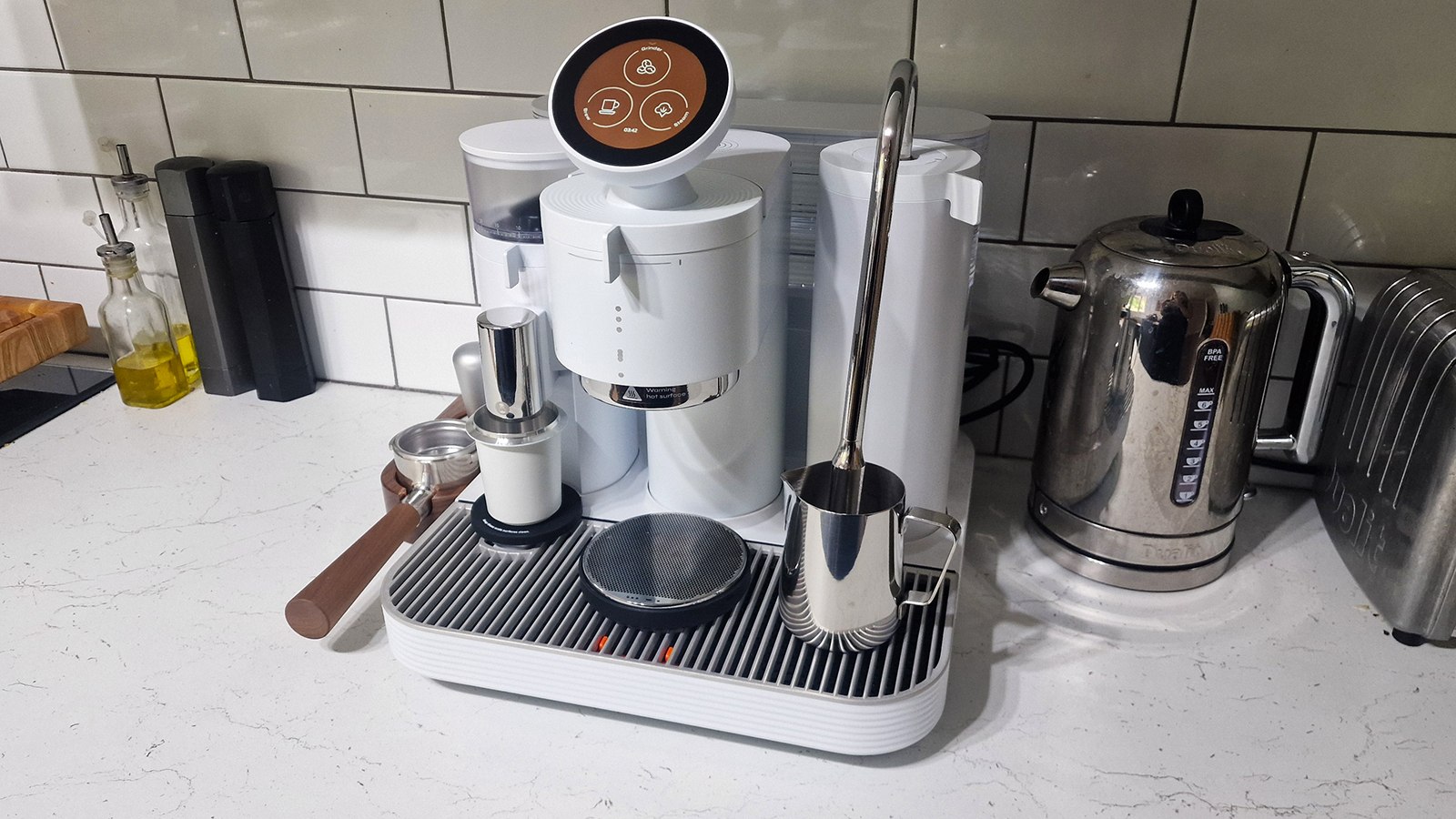 Meraki espresso machine set up on a white countertop