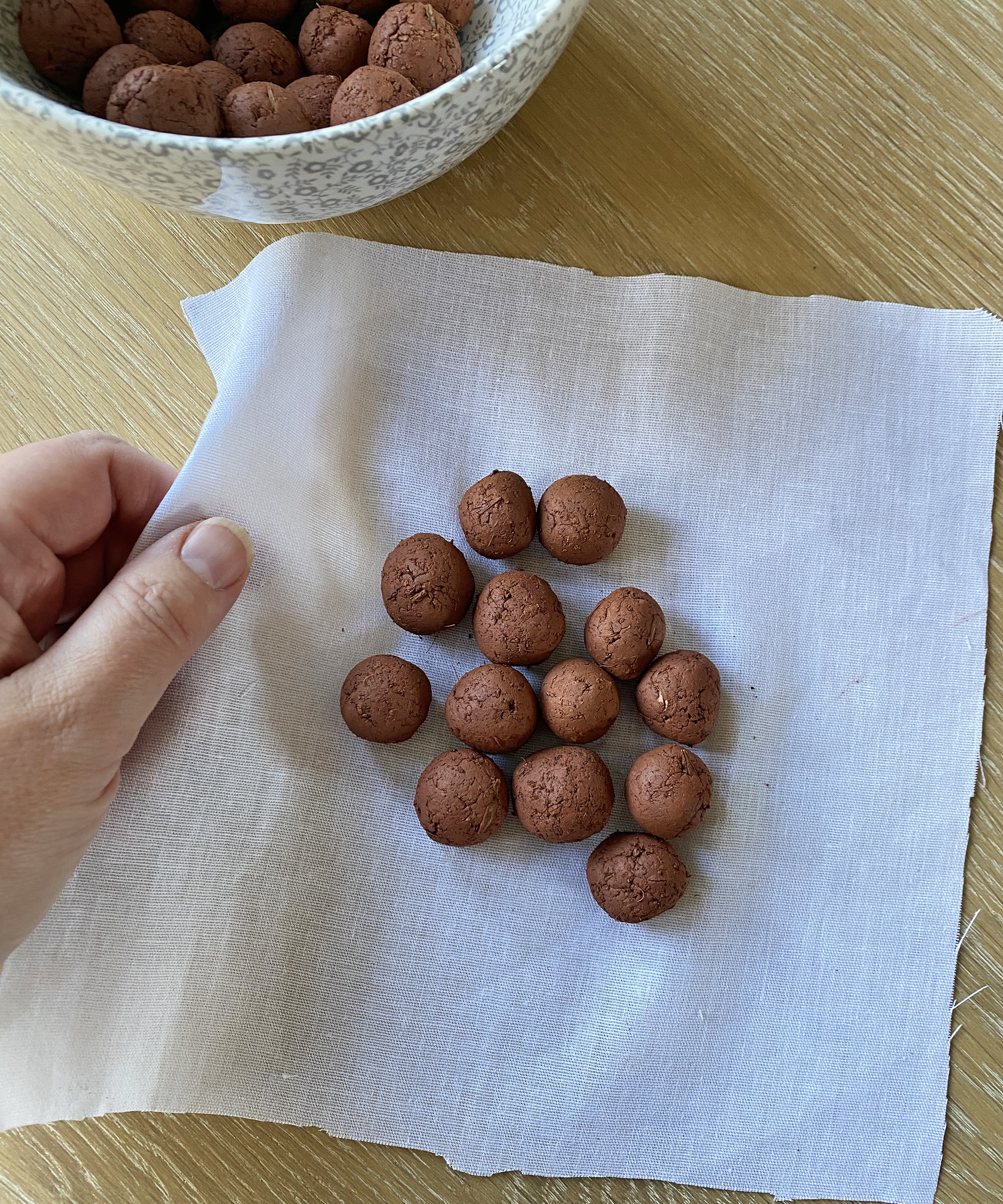 Wrapping seed bombs in muslin square