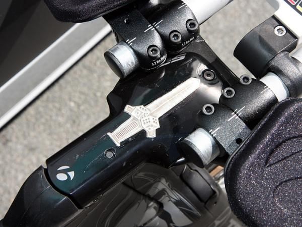 The sword and dice on the stem distract your eyes from the cutout that provides access to the Shimano Dura-Ace Di2 control box button.