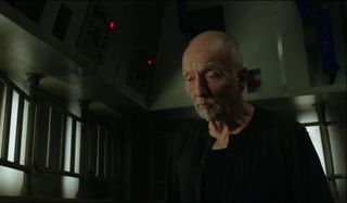 Tobin Bell stands in one of the trap rooms in Jigsaw.
