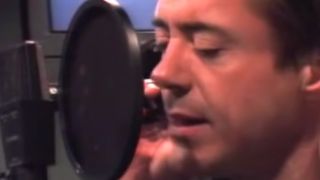 Robert Downey Jr. singing into a microphone