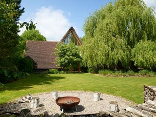 exterior of house viewed from the garden with firepit
