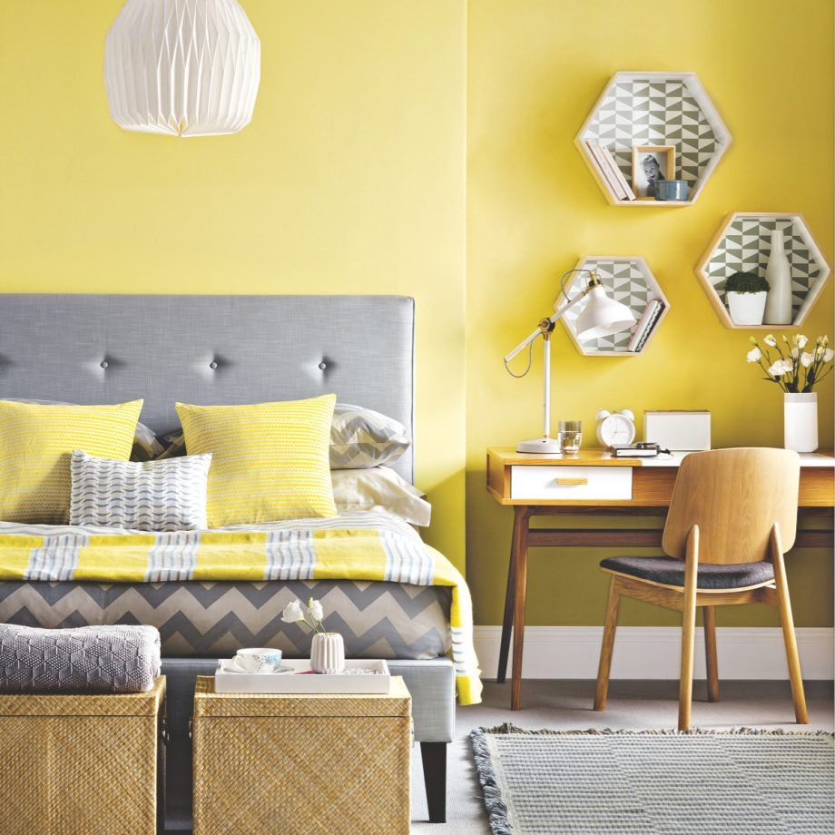 yellow bedroom with grey bed