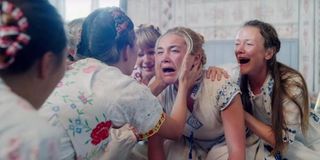 Florence Pugh crying and moaning with group in Midsommar