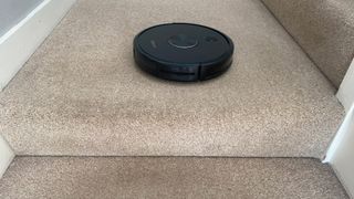 The Ultenic D5s Pro Robot Vacuum and Mop at the top of a staircase