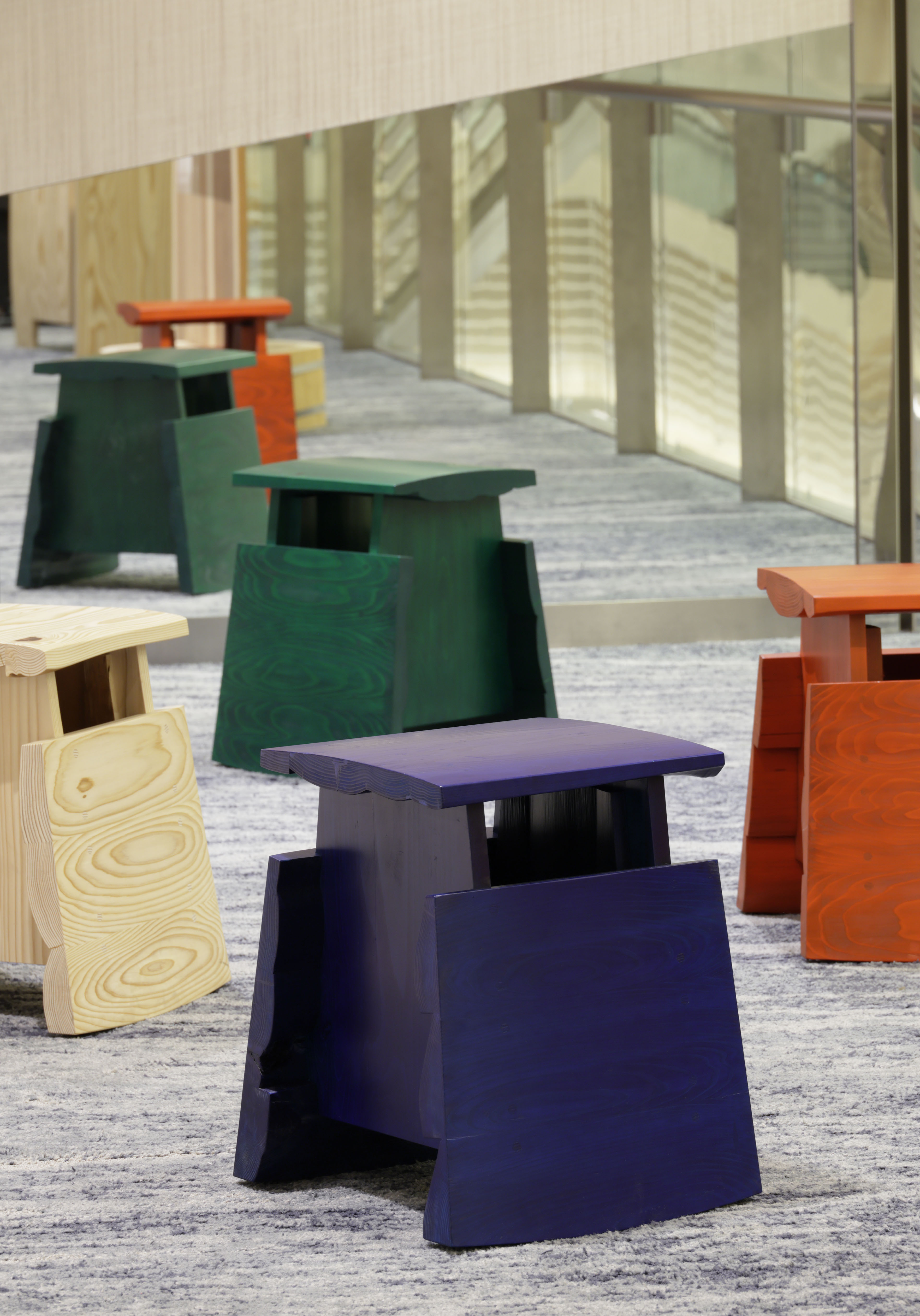 chairs in colourful cedarwood by Rio Kobayashi