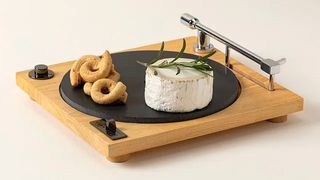 turntable cheese board with cheese and crackers